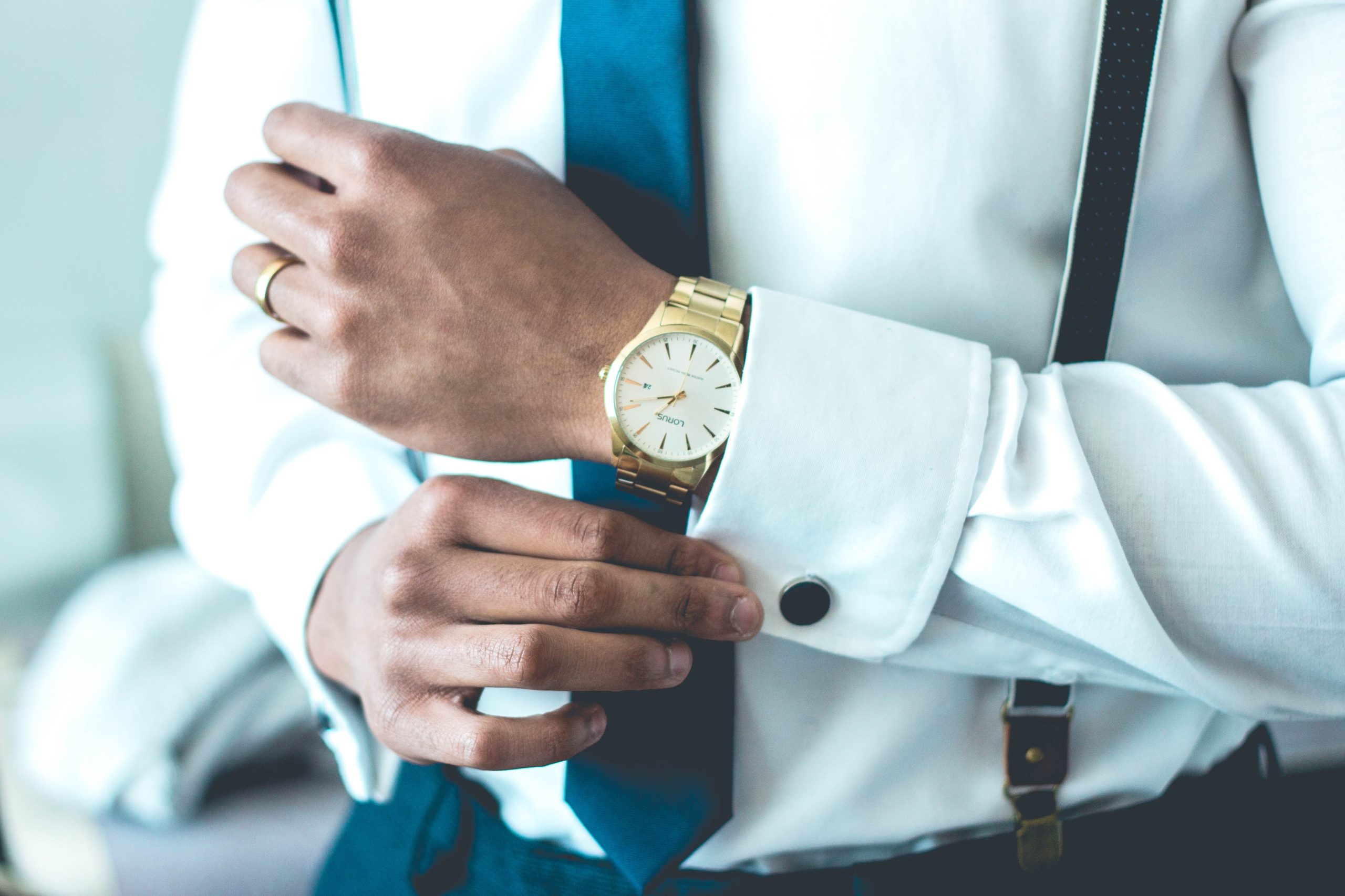 man-with-gold-watch-dressed-up